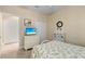 Nicely decorated bedroom with a bed, dresser, and a view towards an ensuite bathroom at 2070 Crystal Lake Trl, Bradenton, FL 34211