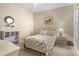Well-maintained bedroom with a decorative bed, neutral walls, and ample natural light at 2070 Crystal Lake Trl, Bradenton, FL 34211