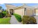 Charming single-story home entrance with stone walkway and well-maintained landscaping at 2070 Crystal Lake Trl, Bradenton, FL 34211
