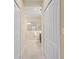 Hallway view leading to the bathroom with dual closets providing ample storage space at 2070 Crystal Lake Trl, Bradenton, FL 34211