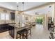 Open-concept kitchen with dark cabinetry, granite countertops, and views of the living area at 2070 Crystal Lake Trl, Bradenton, FL 34211