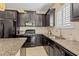 The gourmet kitchen features sleek black appliances, ample counter space, and modern finishes at 2070 Crystal Lake Trl, Bradenton, FL 34211