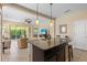 Granite kitchen island provides seating and views to the open living area with ample natural light at 2070 Crystal Lake Trl, Bradenton, FL 34211