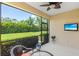 Covered lanai with ample space for entertaining and enjoying the outdoor view at 2070 Crystal Lake Trl, Bradenton, FL 34211