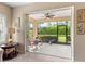 Relaxing screened lanai with a table and chairs, offering a serene outdoor space at 2070 Crystal Lake Trl, Bradenton, FL 34211