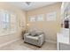 Cozy office area with a comfortable chair, natural light, and built-in shelving at 2070 Crystal Lake Trl, Bradenton, FL 34211