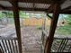 The deck with wooden railings provides a view of the spacious backyard, fenced in and maintained by a worker at 2230 50Th N Ave, St Petersburg, FL 33714