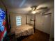 Bedroom features a four poster bed and a dresser at 2230 50Th N Ave, St Petersburg, FL 33714