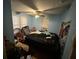 View of a bedroom with blue painted walls, a ceiling fan, and a window air conditioning unit at 2230 50Th N Ave, St Petersburg, FL 33714