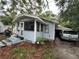 Charming single-Gathering home with a screened-in porch and a car in the driveway at 2230 50Th N Ave, St Petersburg, FL 33714
