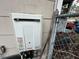 The exterior of the building features a Rinnai tankless water heater with visible piping and connections at 2230 50Th N Ave, St Petersburg, FL 33714