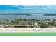 Scenic aerial perspective of condo near beach, Gulf Coast, and residential neighborhood with pristine water at 2310 Gulf N Dr # 104, Bradenton Beach, FL 34217