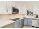 Bright kitchen featuring quartz countertops, stainless steel appliances, and under cabinet lighting at 2310 Gulf N Dr # 104, Bradenton Beach, FL 34217