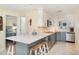 Modern kitchen with stainless steel appliances, stylish countertops, and convenient breakfast bar at 2310 Gulf N Dr # 104, Bradenton Beach, FL 34217