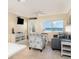 Comfortable living room featuring an ocean view, cozy seating, and beach-inspired décor at 2310 Gulf N Dr # 104, Bradenton Beach, FL 34217