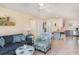Inviting living area with a cozy couch, coastal decor, and an open layout to the kitchen at 2310 Gulf N Dr # 104, Bradenton Beach, FL 34217