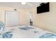 Comfortable main bedroom with an attached closet and modern television at 2310 Gulf N Dr # 104, Bradenton Beach, FL 34217