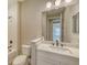 Bright bathroom with white vanity, toilet, and shower/tub combo at 2321 Blue Mahoe Ln, Sarasota, FL 34240