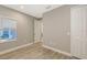 Inviting bedroom featuring a window, neutral walls, and an adjacent closet at 2321 Blue Mahoe Ln, Sarasota, FL 34240