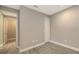 Comfortable bedroom with wood-look floors, neutral paint, and closet at 2321 Blue Mahoe Ln, Sarasota, FL 34240