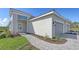 Charming exterior featuring manicured landscaping and a paved pathway leading to the house at 2321 Blue Mahoe Ln, Sarasota, FL 34240