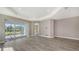 Open-concept living area features tile floors, recessed lighting, and access to the outdoor patio and other rooms at 2321 Blue Mahoe Ln, Sarasota, FL 34240