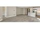 Inviting living space with tile floors, neutral walls, and an open layout connecting to the modern kitchen at 2321 Blue Mahoe Ln, Sarasota, FL 34240