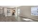 Bright, open living space features tile flooring, light-colored walls, and views into the modern kitchen area at 2321 Blue Mahoe Ln, Sarasota, FL 34240