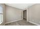 Well-lit office space featuring wood-look flooring, neutral gray walls, and a glass door at 2321 Blue Mahoe Ln, Sarasota, FL 34240