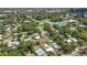 Scenic aerial view showcases neighborhood homes in a lush setting near parks, pools and recreation at 2558 Hawthorne St, Sarasota, FL 34239