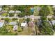 Residential home adjacent to a park with colorful playground set surrounded by trees at 2558 Hawthorne St, Sarasota, FL 34239