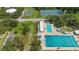 Aerial capture displays community tennis and basketball courts, pool, and recreation facilities at 2558 Hawthorne St, Sarasota, FL 34239