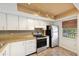 This spacious kitchen boasts modern appliances and ample cabinet space at 2639 Woodgate Ln # H8, Sarasota, FL 34231