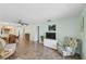 Bright living area featuring neutral paint, tile floors, and plenty of natural light at 2639 Woodgate Ln # H8, Sarasota, FL 34231