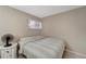 Cozy bedroom with neutral walls, natural light, and carpeted floors at 2763 Woodgate Ln # 211, Sarasota, FL 34231
