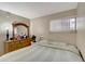 Inviting bedroom featuring light walls, a large bed, and natural light at 2763 Woodgate Ln # 211, Sarasota, FL 34231