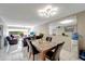 Dining room area with neutral walls, ceiling fan, a mirror, and tile floors at 2763 Woodgate Ln # 211, Sarasota, FL 34231