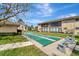 Enjoy outdoor community shuffleboard courts nestled amongst manicured landscaping and walkways at 2763 Woodgate Ln # 211, Sarasota, FL 34231