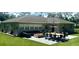 Relaxing backyard featuring a spacious patio with stylish furniture and an elegant dining area for outdoor entertaining at 2912 51St E St, Bradenton, FL 34208
