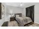 Cozy bedroom showcasing a comfortable bed, modern nightstand, and serene decor for restful nights at 2912 51St E St, Bradenton, FL 34208