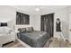 Relaxing bedroom highlighting a plush bed, stylish curtains, and calming ambiance for restful sleep at 2912 51St E St, Bradenton, FL 34208