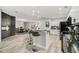 Modern kitchen featuring sleek black appliances, a stylish island with bar stools, and plenty of counter space at 2912 51St E St, Bradenton, FL 34208