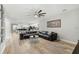 Bright, open living space featuring tile floors, a large sectional sofa, and views into the modern kitchen at 2912 51St E St, Bradenton, FL 34208