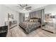 Main bedroom showcasing a decorative ceiling fan, mirrored dresser, and stylish decor at 2912 51St E St, Bradenton, FL 34208