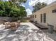 Backyard patio area features seating, grill, and manicured gravel at 2933 Michigan St, Sarasota, FL 34237