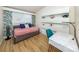 Spare bedroom featuring daybed, desk and shelving unit at 2933 Michigan St, Sarasota, FL 34237