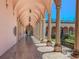 Elegant arched courtyard with columns, statues, and lush greenery under a clear blue sky at 2933 Michigan St, Sarasota, FL 34237