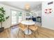 Open dining area with access to the backyard, featuring a table setting for four at 2933 Michigan St, Sarasota, FL 34237