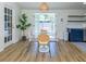 Bright dining area adjacent to the kitchen, featuring a round table and a view of the backyard at 2933 Michigan St, Sarasota, FL 34237