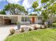 Inviting front porch with bright orange door and seating area perfect for relaxing at 2933 Michigan St, Sarasota, FL 34237